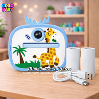 Mini camera and printer with a giraffe design on a wooden table.