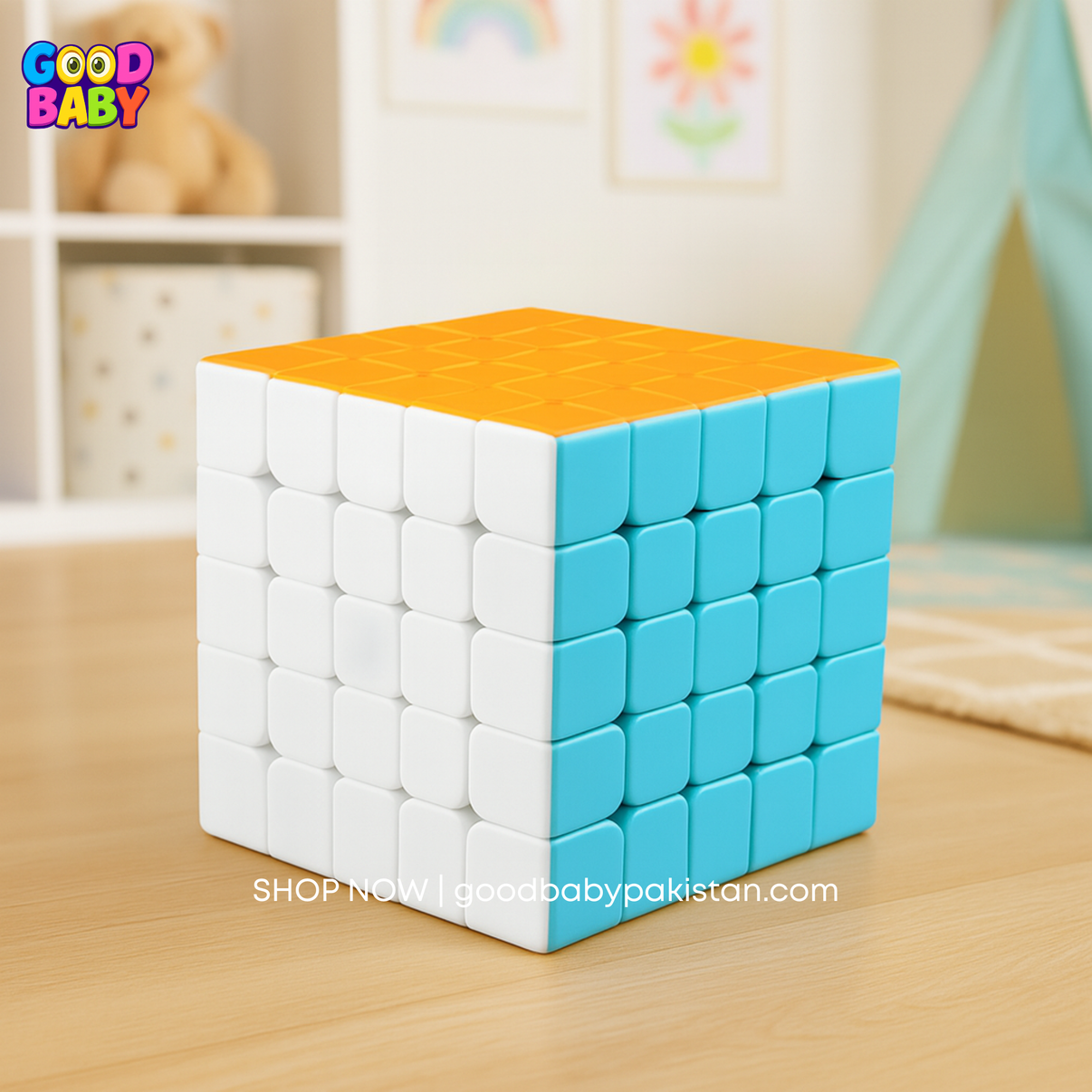 Colorful Rubik's Cube on a wooden surface with 'Good Baby' branding.