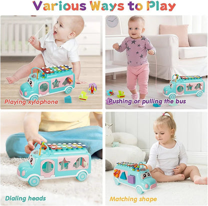  "Toddler playing musical xylophone toy on multifunctional school bus – promotes music and fine motor skills"
