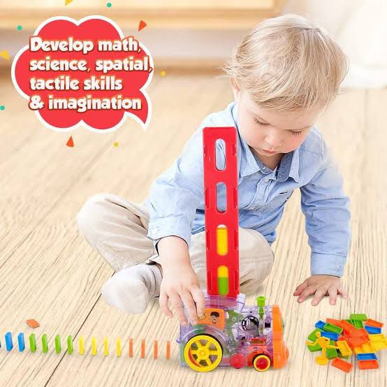 "Simulated train toy with domino setup and steering chimney, powered by 2 AA batteries."
