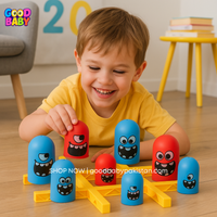 Child playing with colorful toy blocks on a wooden floor
